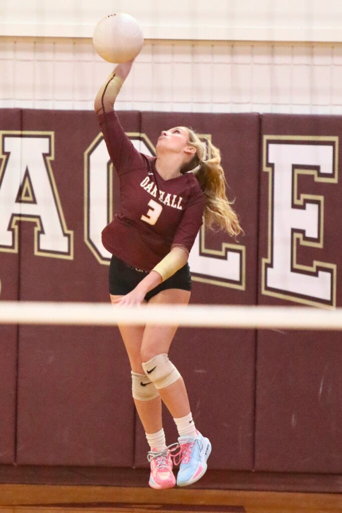 Oak Hall's Sophie Thompson with a serve against St. Francis Catholic Academy on Tuesday.