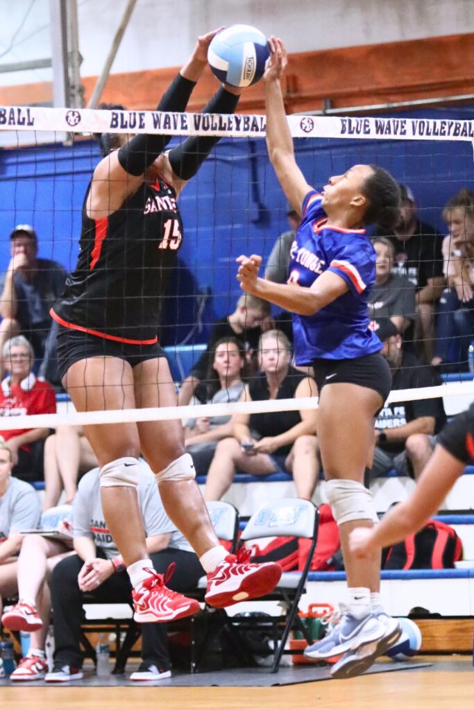 P.K. Yonge's Holdyn Moore (9) with a hit against Santa Fe's Gia McGrew (15) on Thursday.