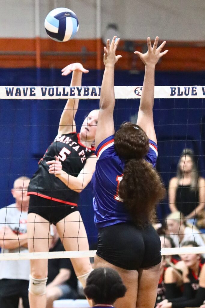 Santa Fe's Delaney Wingenbach (5) with a hit against P.K. Yonge's Trinity Jacobs on Thursday.