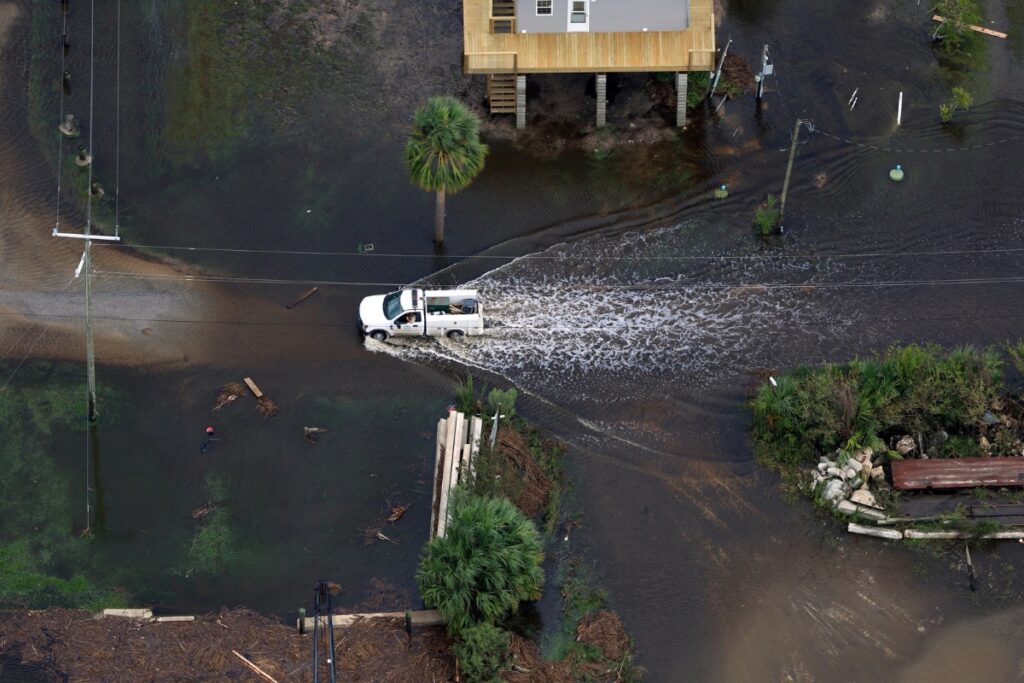 A truck treads water in Suwannee, Fla., on Friday. 