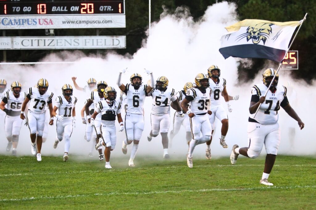 The 2024 Buchholz football team entering the field.