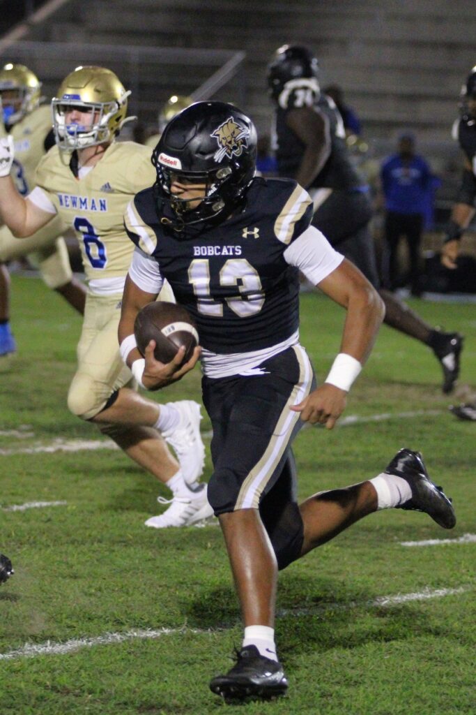 Bobcats' Justin Williams runs and finds the edge on the opening drive against Cardinal Newman (West Palm Beach).