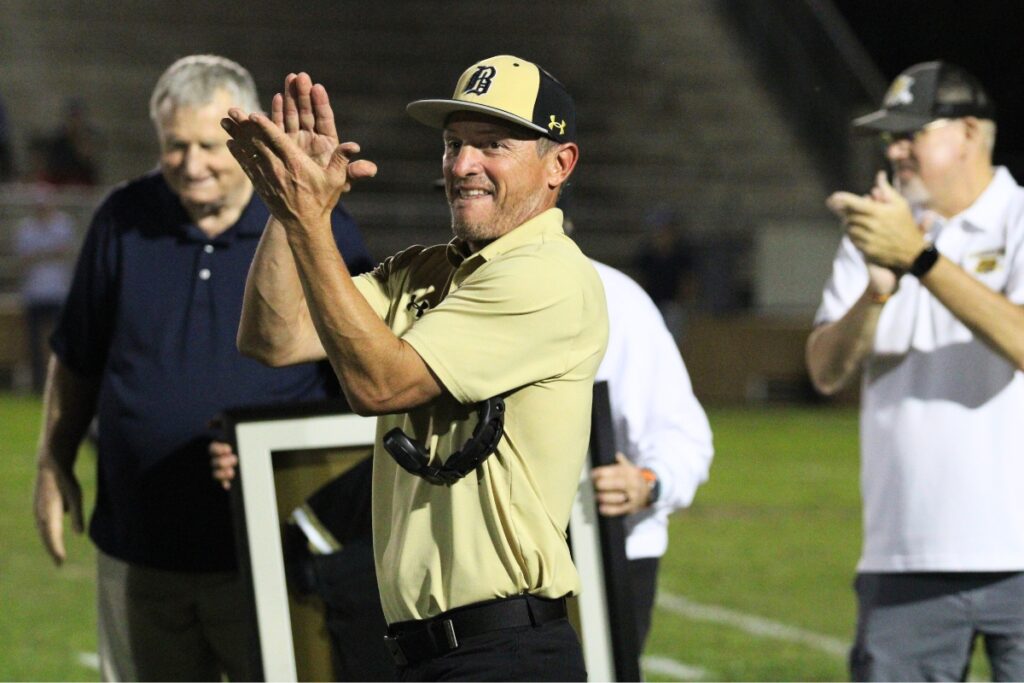 Buchholz head coach Mark Whittemore applauds former Bobcat coaches in a special recognition ceremony on Thursday.