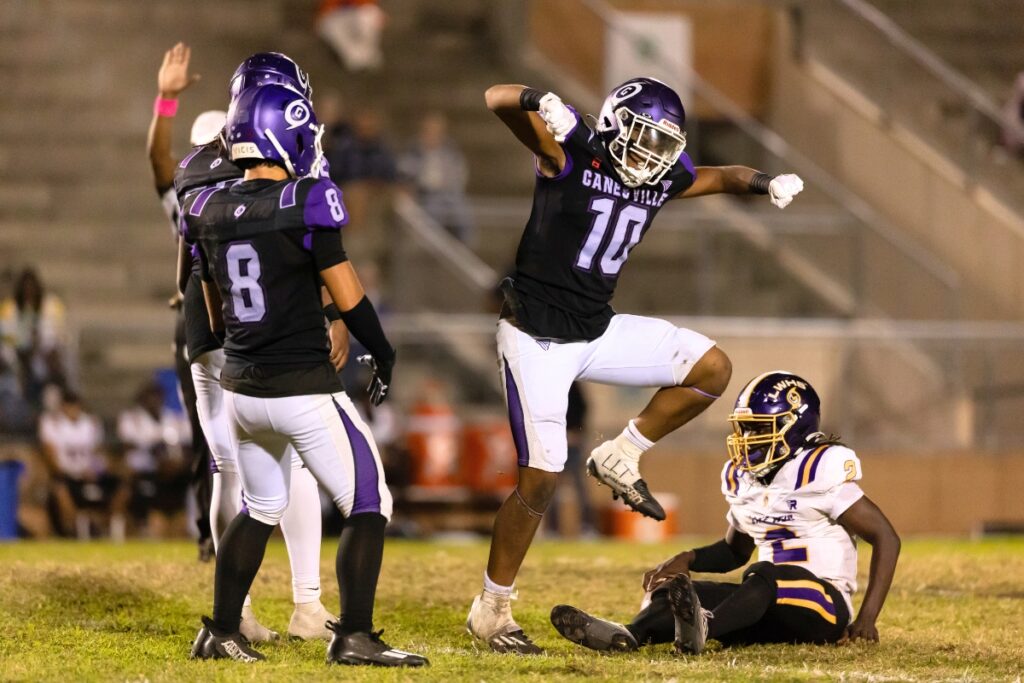 Gainesville's Jalen Johnson (10) celebrates after a big sack against Lake Weir (Ocala).