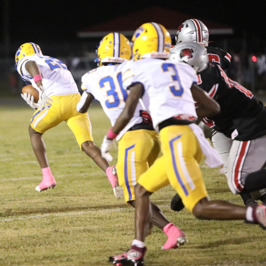 Newberry's Malachi Lancaster (22) scoops up a Williston fumble and returns it for a second-quarter touchdown.