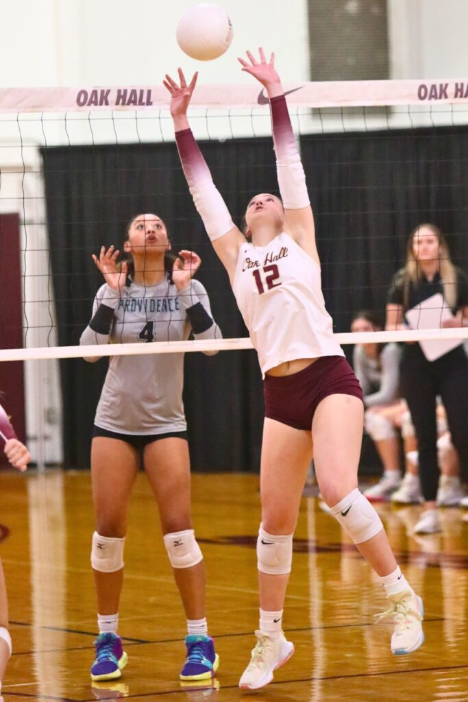 Oak Hall's Cassidy McDonald (12) with a set against Providence (Jacksonville) in the Class 2A-Region 1 Quarterfinals.