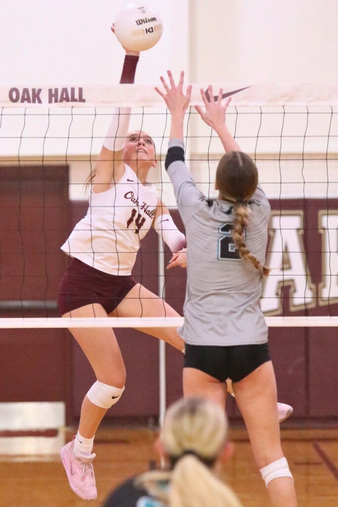 Oak Hall's Kendylle Bishop (14) goes for a hit against Providence (Jacksonville) in the Class 2A-Region 1 Quarterfinals.