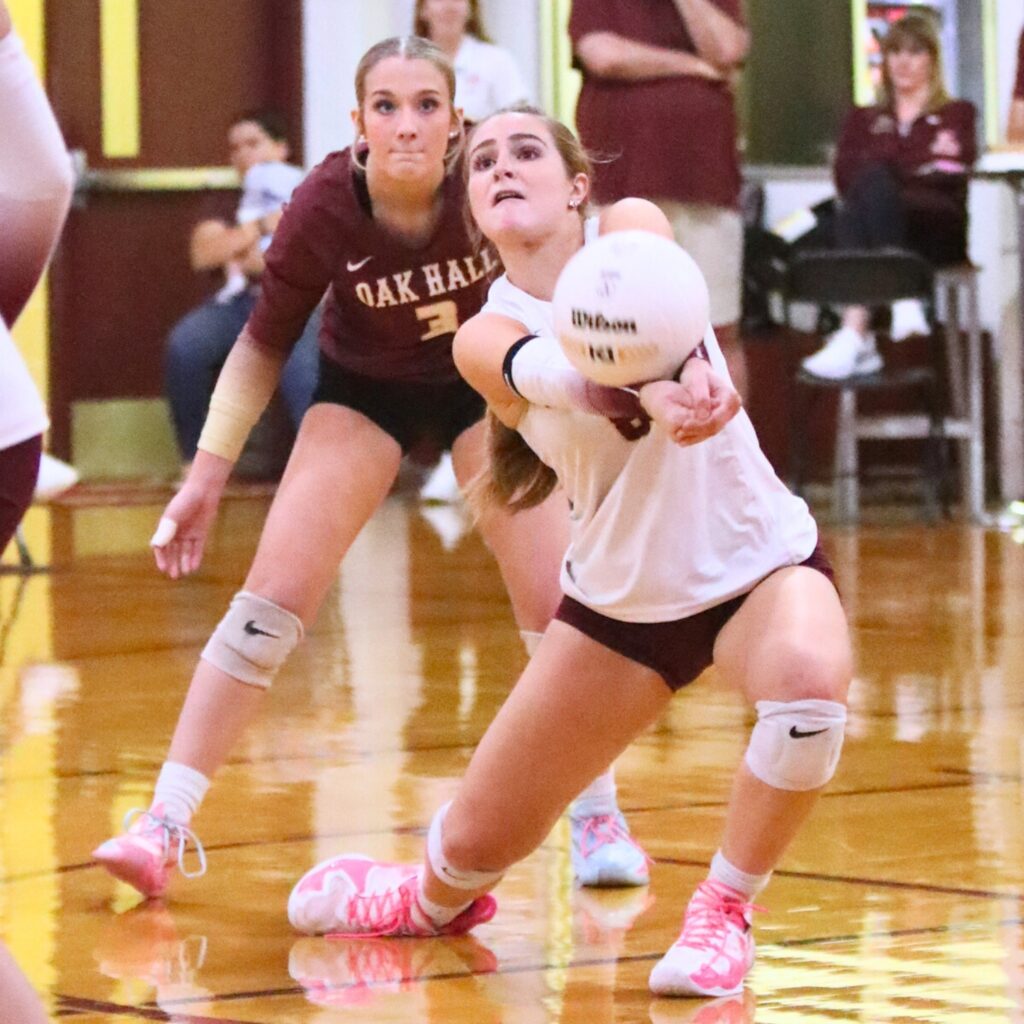 Oak Hall's Sarah Miller (8) with a dig against Providence (Jacksonville) in the Class 2A-Region 1 Quarterfinals.