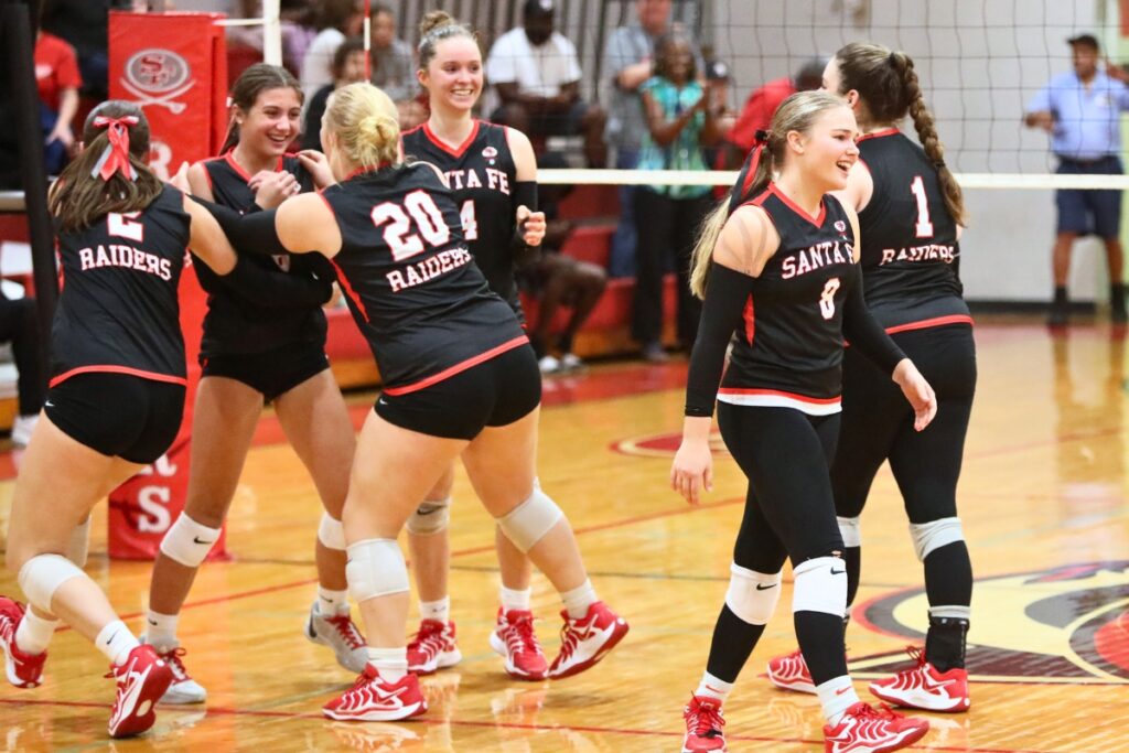 Santa Fe celebrates after Avarey Cole (second from left) served a match-winning ace against Satellite in the Class 4A Region 2 Quarterfinals.