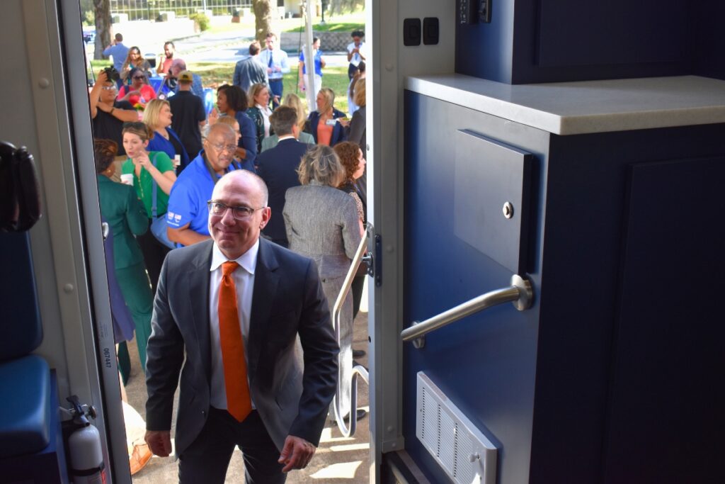 Stephen Motew climbs into the new connector van.