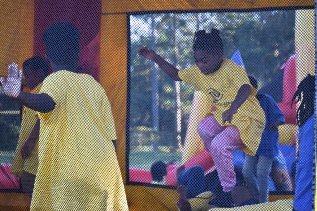 Students flocked to the bounce houses at Thursday's event.
