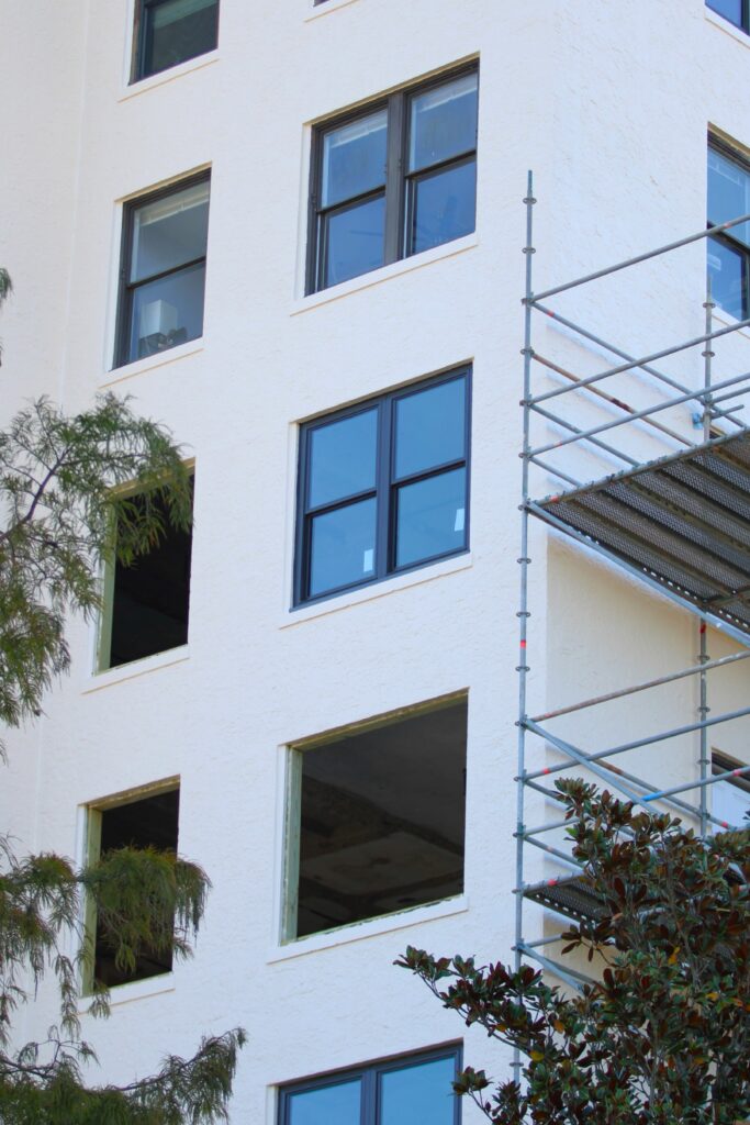 Trimark Properties worked to match the existing windows, top, with the new windows, middle, as the company replaces 500 windows and refurbishes another 150 windows. Photo by Seth Johnson