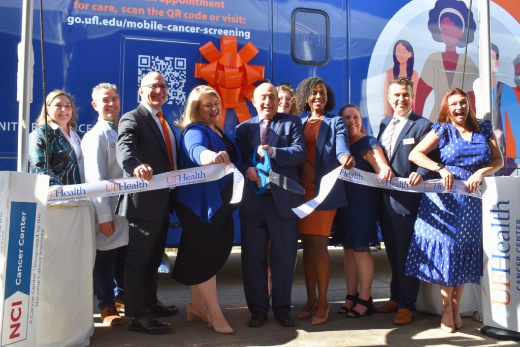 UF Health representatives cut the ribbon for the new mobile screening connector.
