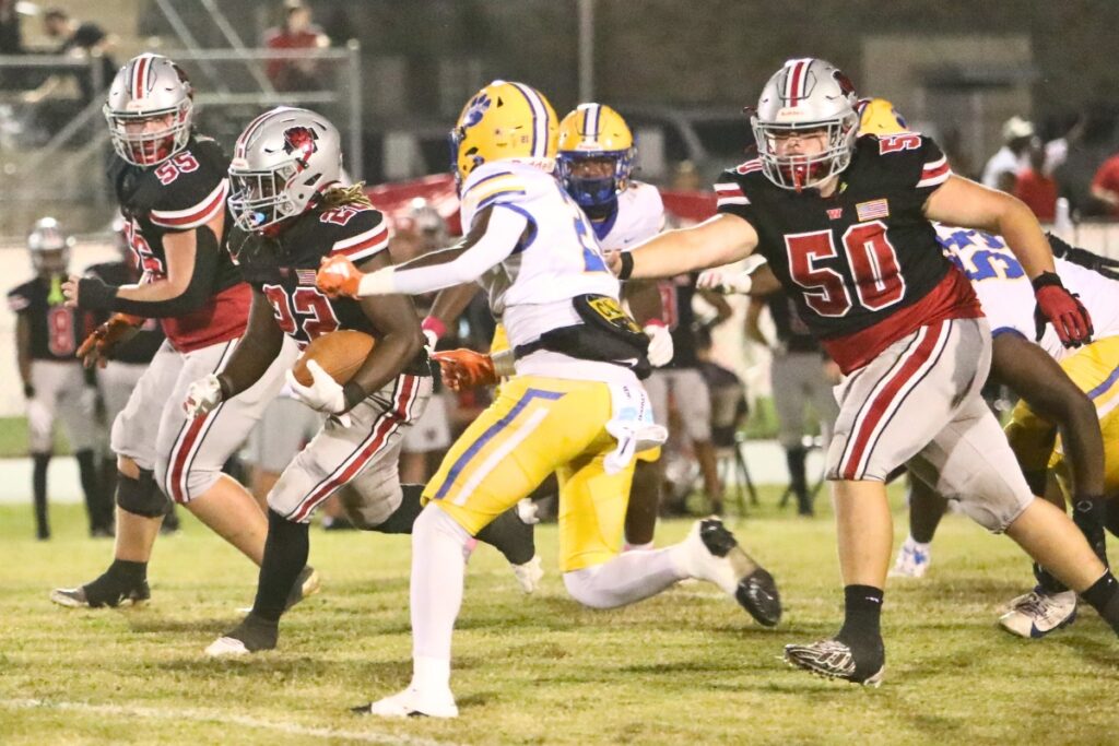 Williston's Jamari Williams (22) with a second-quarter run against Newberry.
