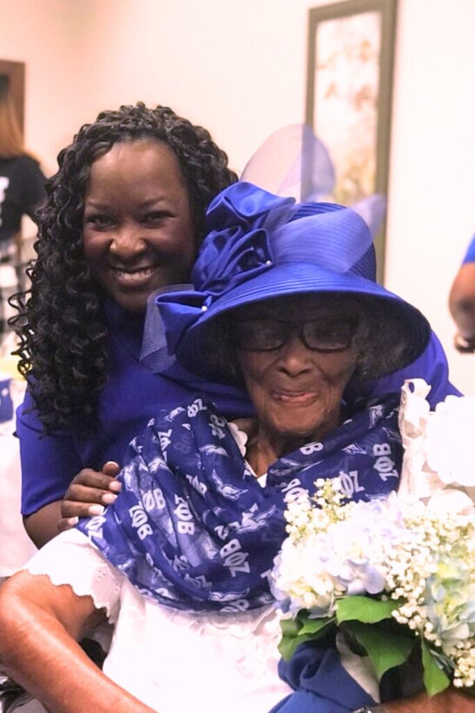Yvette Carter (left) with Cora Roberson at a scholarship breakfast. 