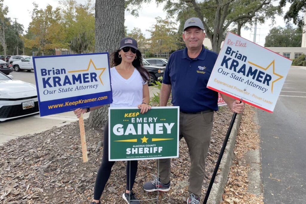 State Attorney Brian Kramer and Brande Smith greet voters at the Hilton UF.