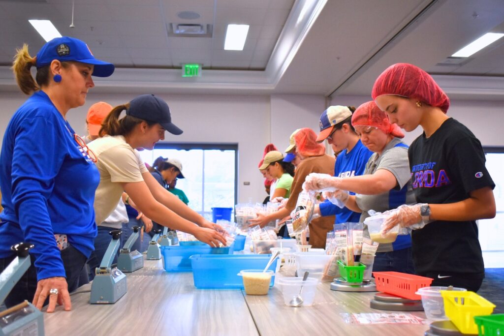 About 140 students and community members came together to pack food for Rise Against Hunger.