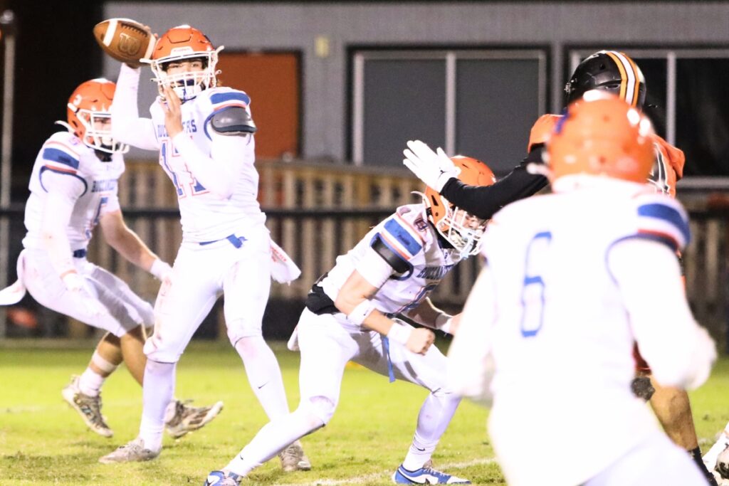 Branford's Trent Land (17) with a quick pass against Hawthorne.