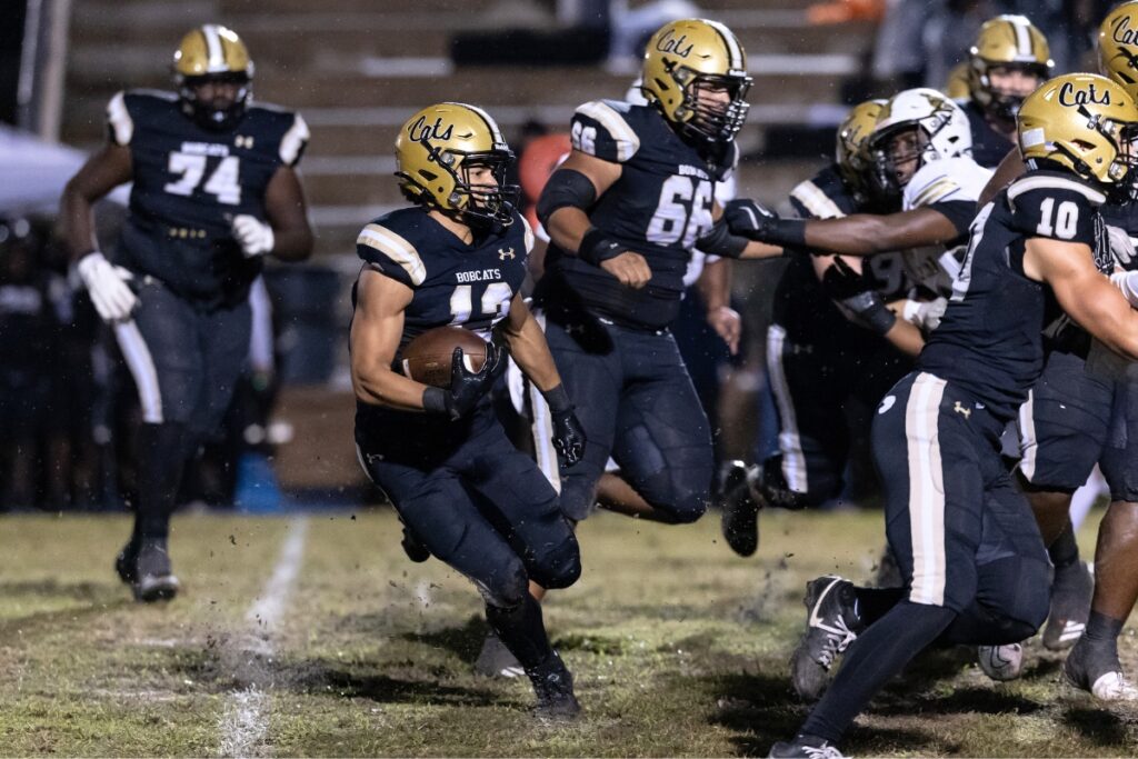 Buchholz's Justin Williams (13) with a run against Oakleaf.