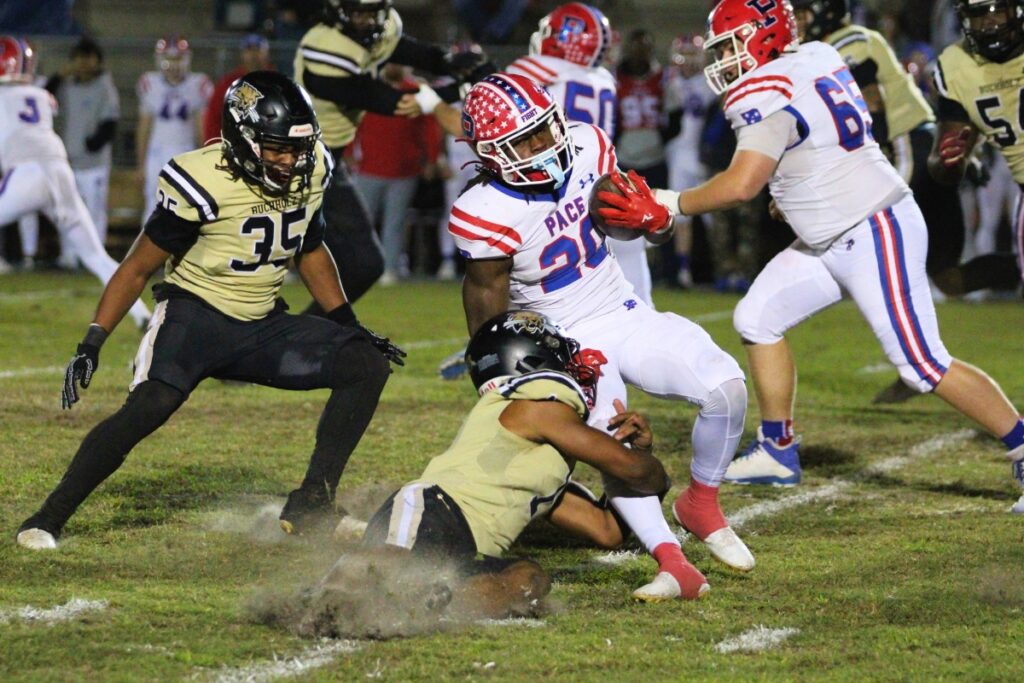 Buchholz's RJ Livingston brings down a Patriots runner. Photo by Seth Johnson
