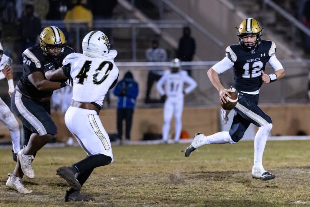 Buchholz's Trace Johnson (12) scrambles against Oakleaf.