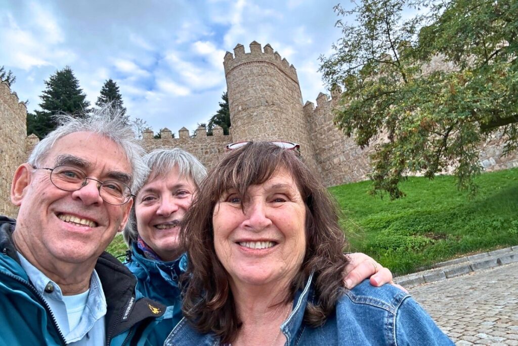 Correspondent Ronnie Lovler with friends and travel companions Juan Melendez and Petra Gebert in front of the Avila wall.
