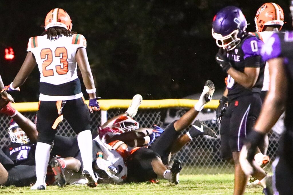 Eastside's Kamariyon Mack recovers a fumble in the end zone on a snap that sailed over the Gainesville quarterback's head in the first quarter.