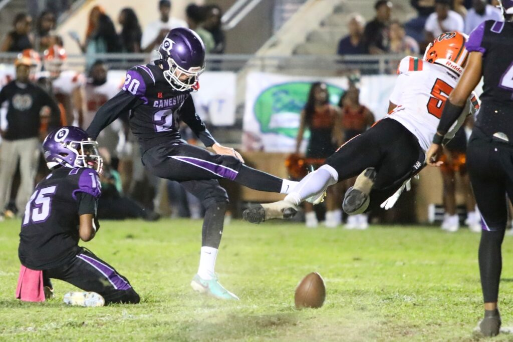 Eastside's Victor White (5) blocks Gainesville kick Alex Probert's first-quarter field goal attempt.