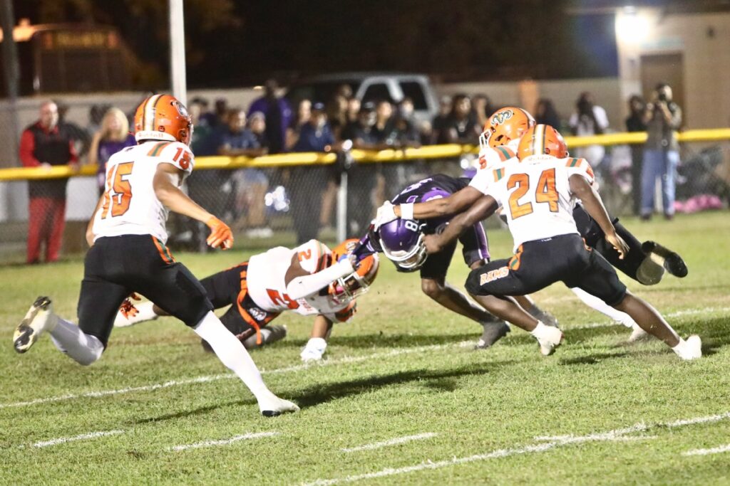 Gainesville's Camron Burse (88) taken down at the 5-yard line by multiple Eastside players on the opening kickoff.