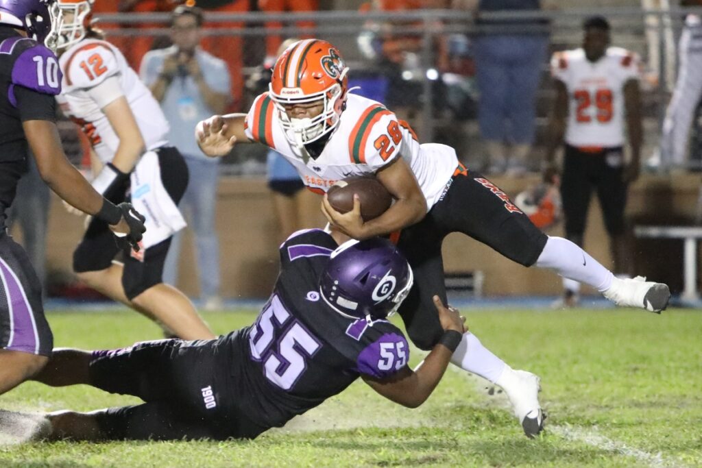 Gainesville's Murquit Rowe Jr. (55) tackles Eastside's Kenneth McClellan (28).