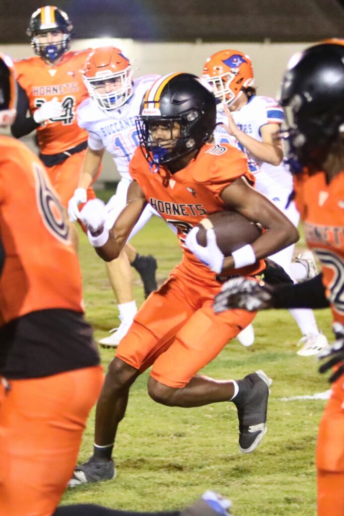 Hawthorne's Dacarion Debose (3) returns the opening kickoff for a touchdown against Branford on Friday.