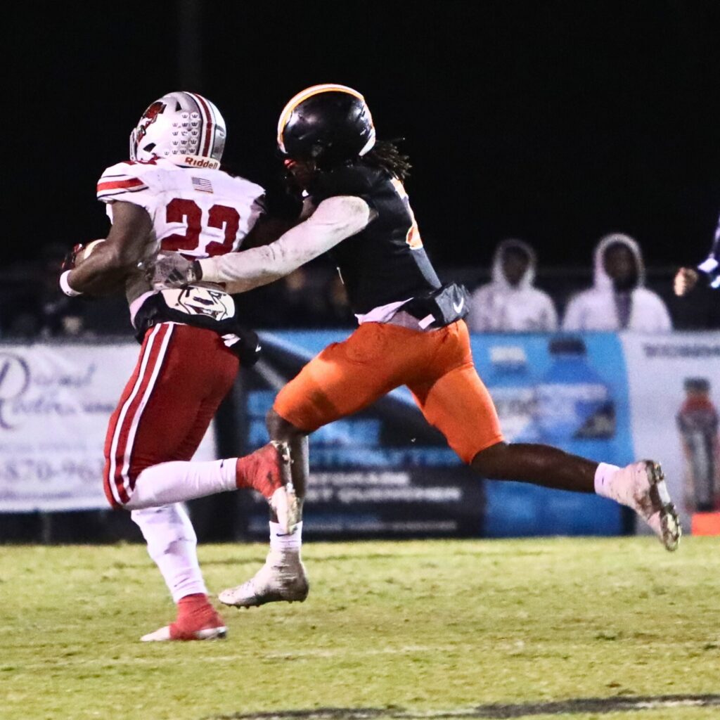 Hawthorne's Nathan Jennings (2) tracks down Williston's Jamari Williams (22) after around the 10-yard line after a long first-quarter run.