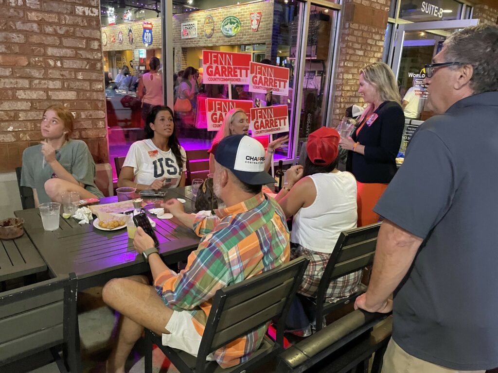 Jenn Garrett speaks with supporters at World of Beer during an election night watch party. 