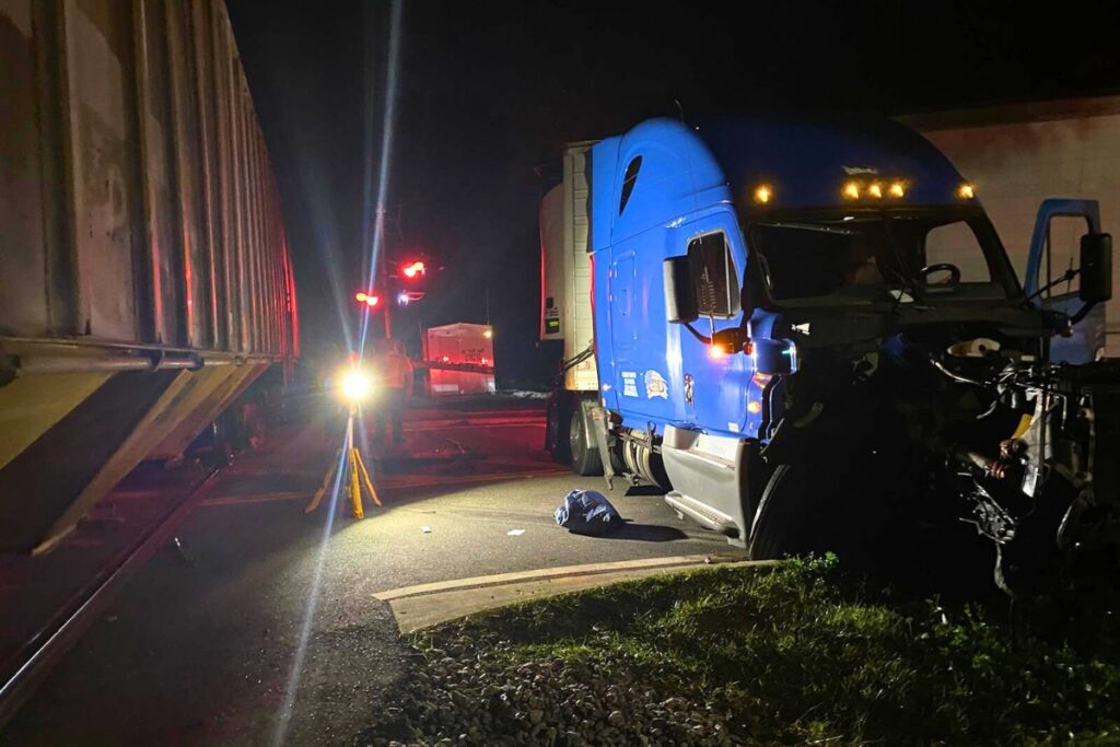 One person was injured when a train collided with two tractor-trailers at a railroad crossing in Hawthorne on Monday night.