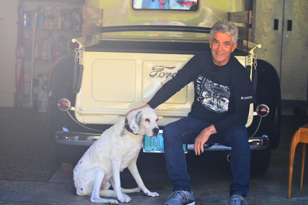 Randy Batista and his dog Bode in front of the photographer's 1947 Ford truck.