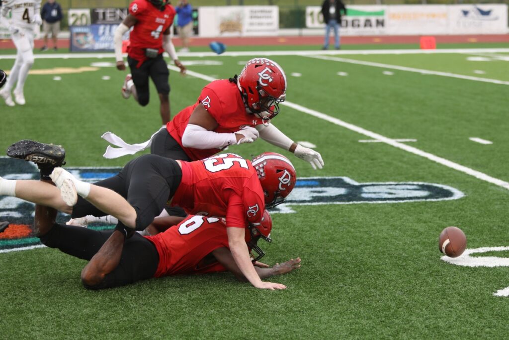 Dixie County defenders go after a Fort Meade fumble in the first quarter of the Florida Rural Invitational Tournament championship game.