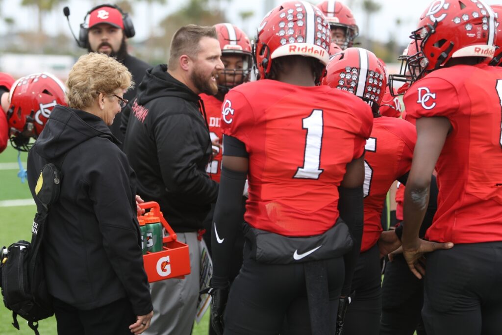 Dixie County head coach Ric Wittington talks to his defense during a timeout against Fort Meade in the Florida Rural Invitational Tournament championship game.