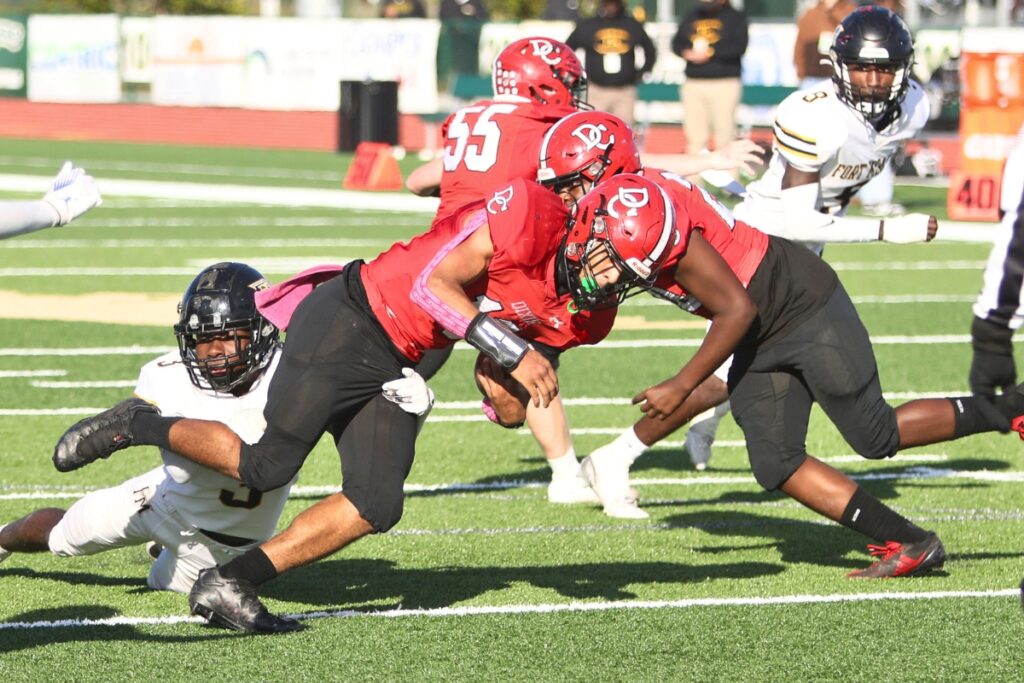 Dixie County's Javan Wilson (10) gets a first down in the third quarter against Fort Meade in the Florida Rural Invitational Tournament championship game.
