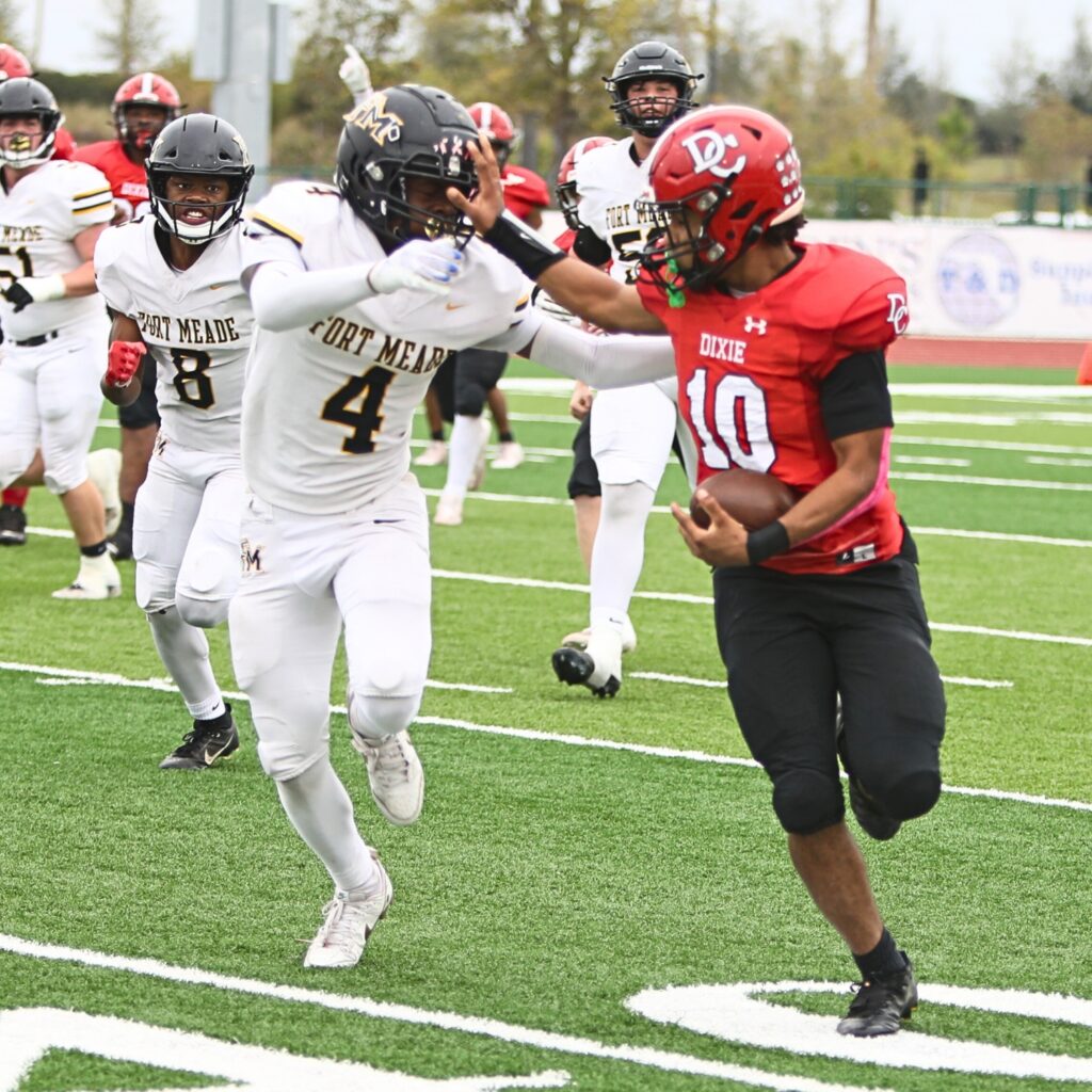 Dixie County's Javan Wilson (10) takes a short pass for a first down against Fort Meade in the Florida Rural Invitational Tournament championship game.