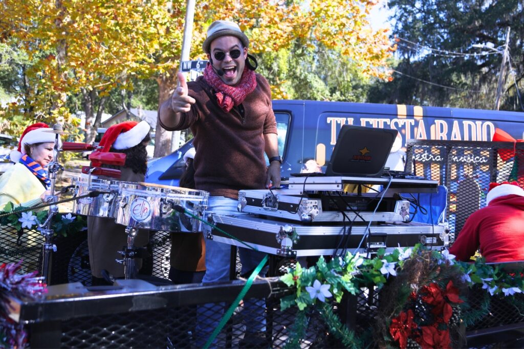 Elio Piedra with Tu Fiesta Radio at the 2024 A Very GNV Holiday Parade in Gainesville.