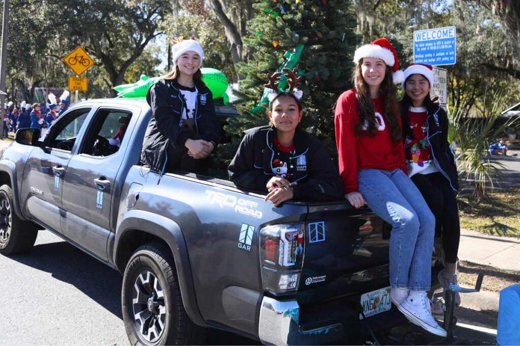Member of the Gainesville Area Rowing float at the 2024 A Very GNV Holiday Parade in Gainesville.
