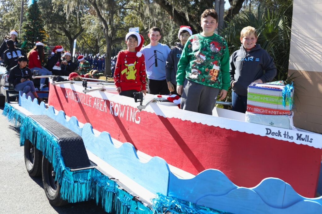 Member of the Gainesville Area Rowing float preparing for the 2024 A Very GNV Holiday Parade in Gainesville.