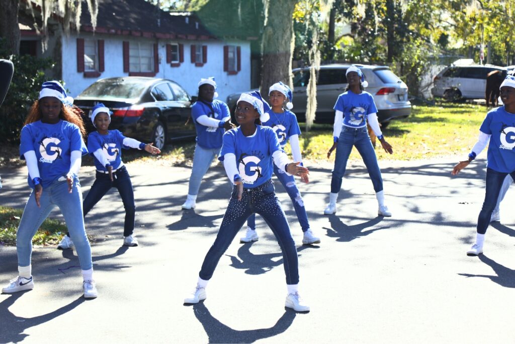 Members of Generation of Decision at Howard Bishop practicing their performance prior to the 2024 A Very GNV Holiday Parade in Gainesville.