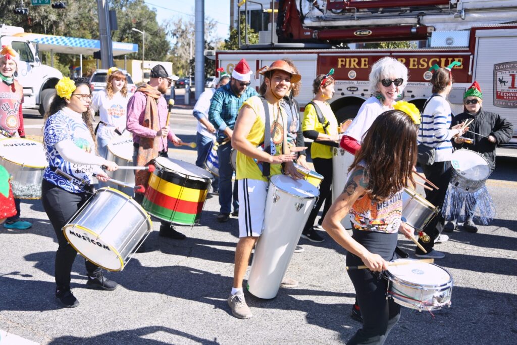 Members of the BLOCO Gainesville Afro-Brazilian drummers preparing for the the 2024 A Very GNV Holiday Parade in Gainesville.