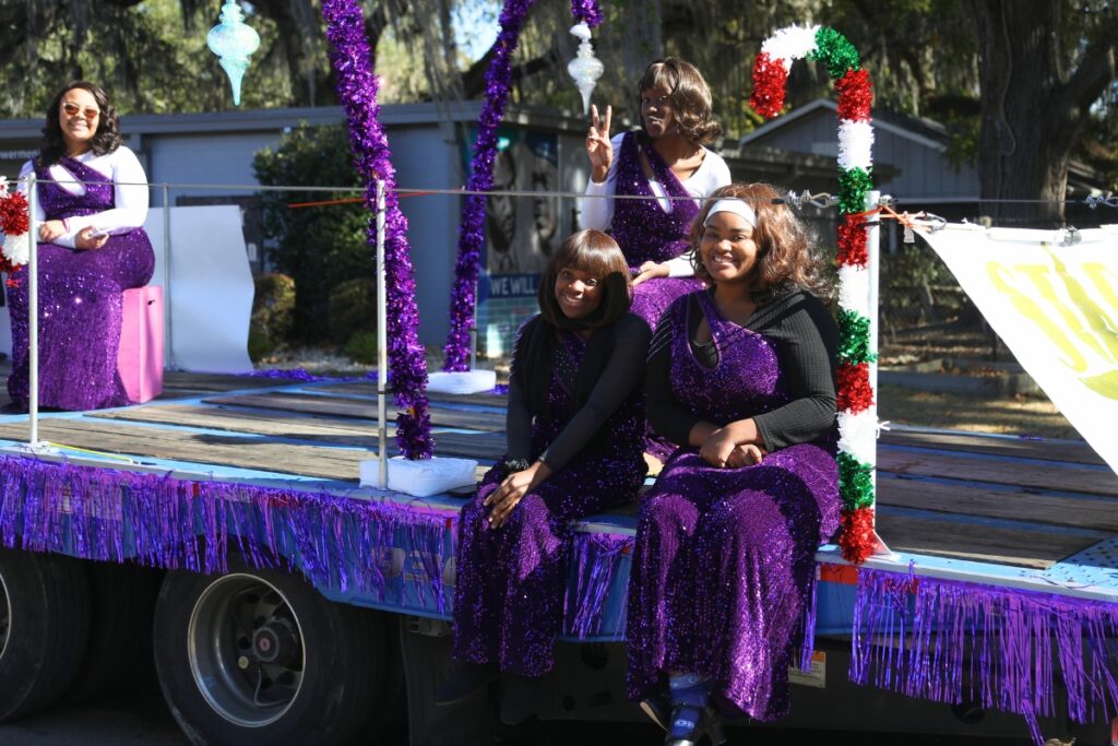 Members of the Star Center Theater float at the 2024 A Very GNV Holiday Parade in Gainesville.