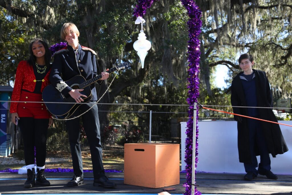 Participants of the Star Center Theater float at the 2024 A Very GNV Holiday Parade in Gainesville.