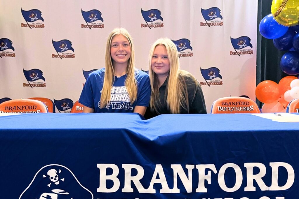 Branford's Morgan Brennan (left) and Laila Arnold signed to play college softball. Photo by Mike Ridaught