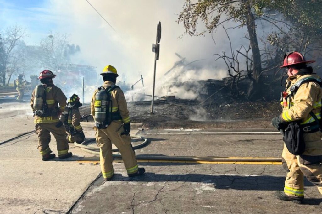 Firefighters work to extinguish a blaze that destroyed a two-story home in Waldo on Tuesday morning.