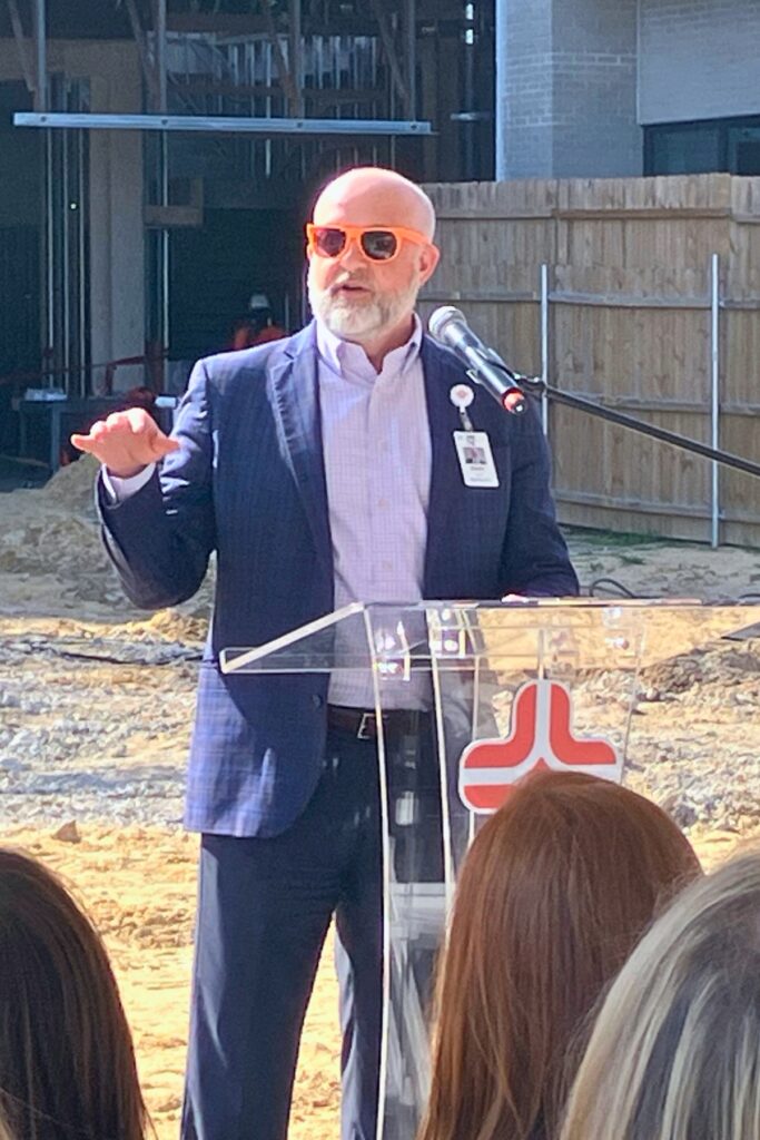 HCA North Florida Hospital chief operating officer Mark Amox speaks at Topping Out ceremony. Photo by Lillian Hamman