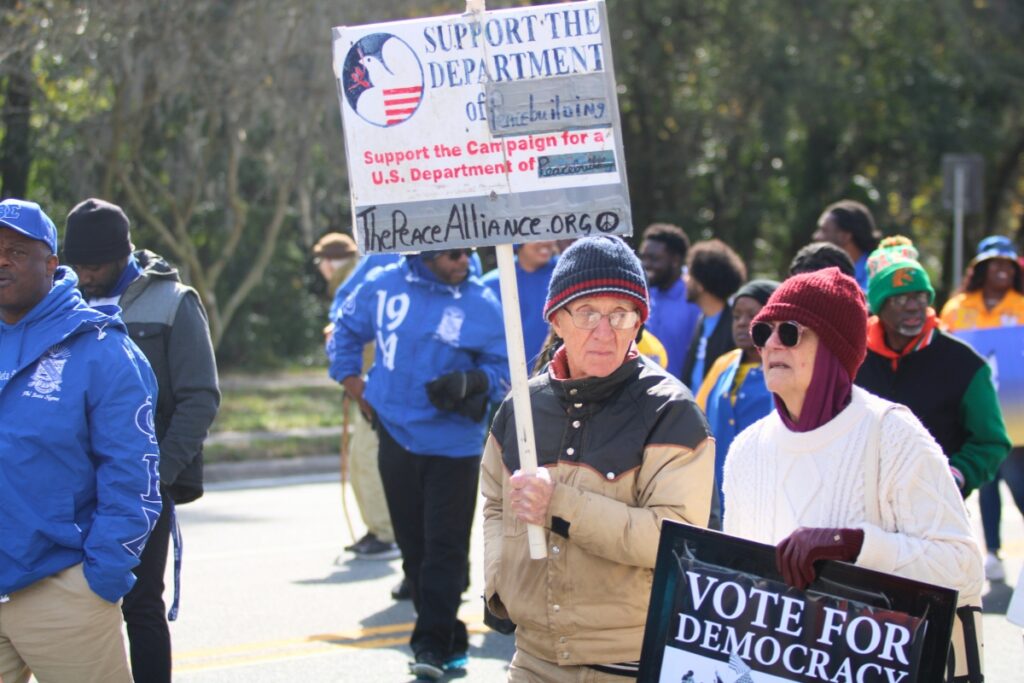 Marchers support their causes during the annual MLK Day Parade. Photo by Lillian Hamman